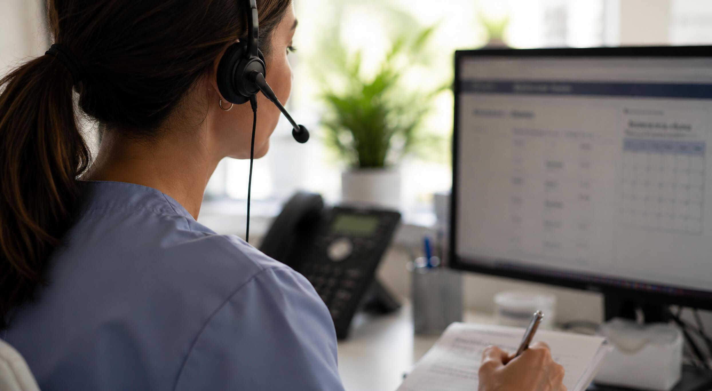 A Care Navigation specialist coordinating care by phone