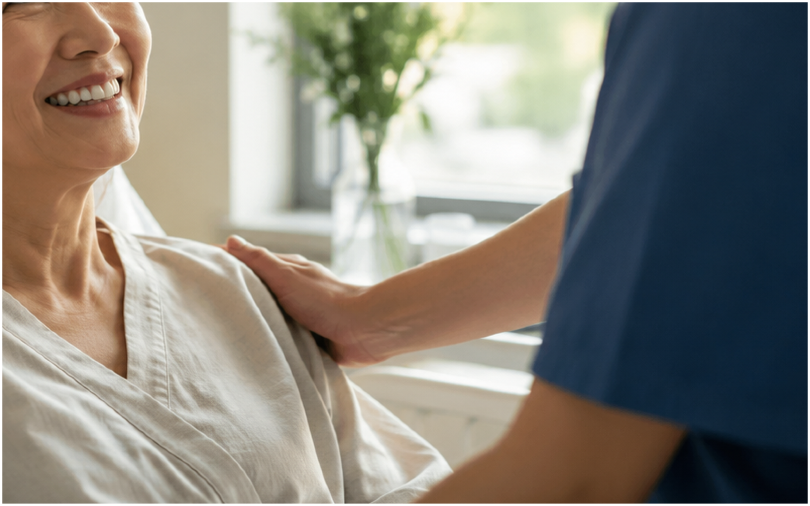 A nurse reassuring a smiling patient